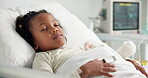 Medical, sleeping and patient or child in hospital bed for icu recovery, healthcare treatment and relax. Pediatrician facility, resting and dreaming with kid for exhausted and monitor progress
