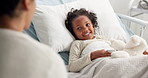 Parent, sick kid and visit in hospital bed for support, love or medical health with family. Guardian, smile or girl patient in clinic for kindness, healthcare help or talking in rehabilitation care
