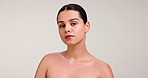 Face, serious and woman for skincare in studio with smooth textures, facial treatment and clear skin. Portrait, female person and beauty with natural shine, dermatology benefits and white background