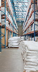 Loader, warehouse and stock on shelf, logistics or goods for supply chain, shipping or distribution. Commercial, supplier and people with merchandise for inventory, wholesale and package in factory