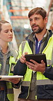 Tablet, supply chain and people in warehouse for inspection, industry or inventory for quality assurance. Walking, digital technology and industrial employees with planning for freight distribution.