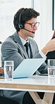 Call center, agent and man with headset, talking or explaining services to contact or telemarketing. Sales, communication and person with laptop for lead generation, consultant or discussion with mic