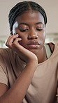 Tired, black woman and thinking with stress in home for depression, loneliness or anxiety. Female person, homeowner or doubt with sad regret for mental health, fatigue or emotional crisis in house