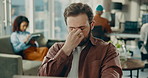 Business, headache and man in office, tired and exhausted with emergency, deadline and copywriting. Person, employee or journalist in workplace, migraine and stress with anxiety, fatigue or burnout