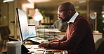 Chart, business and black man typing on computer at night for financial analysis, trading or glasses. Overtime, mature broker or technology for investment, stock market revenue or kpi graph in office