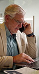 Networking, phone call and businessman with laptop in office for research with contact for finance deal. Technology, talk and mature financial manager on mobile discussion for investment negotiation.