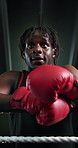 Boxer, athlete and tired with breathing on rope for fight challenge, intense training or adrenaline. Low angle, black man or exhausted in boxing ring for match endurance, sweating or workout recovery