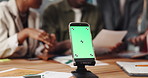 Business people, meeting and phone with green screen for app development, design or planning. Group, employees or software designers with mobile smartphone display for UX, UI testing or mockup space