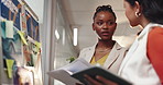 Planning, meeting and women in office for graphic design, research and business ideas. Creative agency, startup team and people with board for brainstorming, portfolio and inspiration for project