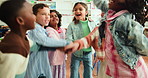 Happy kids, students and unity with hands together in huddle for celebration, success or mission. Group, elementary children or learners with pile, stack or applause for learning or youth development