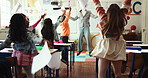 Happy, teacher and children with documents in air for celebration, finished exams or done in school. Excited, group or learners throwing paperwork for test completion, pass or success in classroom