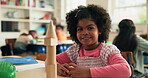 Face, student and child with building blocks, school and wooden shapes in class, knowledge or learn. Education, pupil and girl with cognitive development, problem solving and smile in elementary