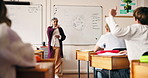 Teacher, woman and student with raised hand in classroom for question, answer and science class. Person, teenager and point with learning, cell diagram and board with education at development academy