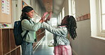 Kids, friends and high five for greeting at school, support or walking in hallway for education. Children, celebration and happy students with teamwork, cooperation or success with girls together