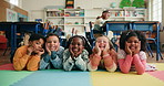 Happy school kids, group and face on floor in classroom, laying and excited for education at academy. Children, boy and girl with friends, portrait and together for learning, smile and relax on mat