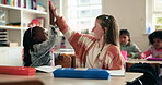 Children, friends and high five in class for learning, support and education in elementary school. Kids, celebration and happy students with teamwork, cooperation and success with girls together