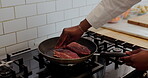 Hands, pan and steak with chef in kitchen of restaurant for preparation of culinary dish or meal. Food, protein and stove with person cooking meat in skillet for cuisine or fine dining recipe