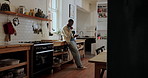 Break, phone and typing with black man in kitchen of home to search for recipe instructions online. App, communication and social media review with person in apartment for meal planning or research