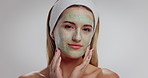 Woman, face and beauty mask in studio with touch, process and pride with mockup space on white background. Girl, model and clay treatment in portrait with smile, glow or natural cosmetics in Italy