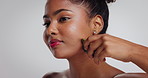 African woman, gua sha and skincare in studio for massage, circulation or benefits on white background. Girl, routine and tools with mockup space, wellness or dermatology for beauty with natural glow