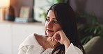 Thinking, relax and woman on sofa in home for reflection, daydreaming and thoughtful for future. Apartment, weekend and person relax with memory, calm and wondering for decision in living room
