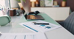 Documents, laptop and pen on desk in home office for planning, remote work or research. Computer, headset and paperwork at workstation in empty apartment for freelance or small business startup
