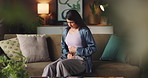 Woman, stomach ache and massage on sofa, home and indigestion with constipation in living room. Person, menstruation and pain with belly, sick or endometriosis with cramps, ibs or gastro at apartment