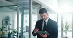 Walking, businessman and online on tablet, office or browsing for investment opportunity on website. Investor, search and person with tech for financial report, scroll and review stock market updates