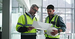 Architect, men or blueprint with discussion in building for office design, remodeling or strategy. Flare, pointing and contractor team with floor plan on site for commercial development or compliance