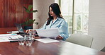 Serious, woman and employee with laptop in office, typing or account manager with documents or info. Confident, bookkeeping and person with tech for financial report, data entry and asset management