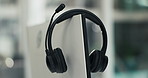 Empty, office and headset on computer in call center for lead generation, online sales and crm. Business, equipment and mic on pc for customer service, virtual assistance and support in workplace