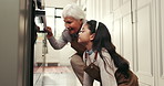 Baking, excited and grandmother with child by oven in kitchen for cupcakes, cookies and cake. Family, home and grandma with girl for bonding, love and learning to make dessert recipe on weekend