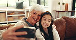 Happy, grandma and selfie with child, home or bonding on visit in lounge, love or affection for girl. Laughing, old woman and memory with kid in living room, profile picture and photography in house