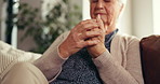 Senior woman, hands and pain with arthritis for joint inflammation or wrist injury on sofa in home. Closeup, elderly or female person with ache or strain for fibromyalgia or carpal tunnel syndrome