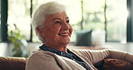 Smile, home and old woman on sofa, watching tv and relax with entertainment, break and funny. Apartment, pensioner and elderly person on couch, humor and comedy movie with happiness and retirement