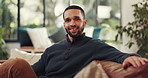 Smile, relax and face of man on sofa of home for comfortable, confidence and calm. Happiness, peace and wellness with male person in living room of apartment for free time, rest and weekend break
