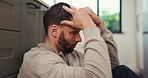 Man, headache and stress with anxiety, depression or burnout on kitchen floor in home. Upset, disappointed or tired and frustrated person with migraine, fatigue or pain in trouble or issue in house