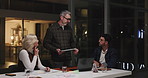 Meeting, night and business people in office with tablet for finance review, online proposal and project. Teamwork, corporate and workers on digital tech for financial report, website and research