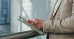 Hands, business and man with tablet in lobby for accounting, finance report and budget review. Person, digital app and typing for research, financial planning and information for funding investment