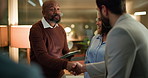 Business, night and people with tablet, handshake and financial agency with agreement for investment. Evening, group and employees in office, shaking hands or teamwork with partnership or negotiation