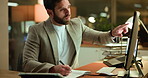 Business, man and pointing to computer at night for trading details, investment info or deadline. Graphs, global trader and tech with notebook in office for stock market strategy or track performance