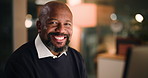Mature, black man and night in office with face, accountant or financial manager with smile. Bookkeeping, portrait and business person with computer, overtime research and administration agency
