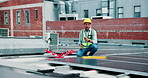 Installation, roof and solar energy with construction worker man outdoor for panel maintenance. Engineering, power and sustainability with person on building in city for development or innovation