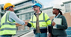 Handshake, engineer and people with solar panel, agreement and electricity in PV installation. Shaking hands, collaboration and team on site for renewable energy, photovoltaic system and project.