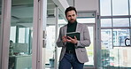 Walking, scroll and man in office with tablet, online browsing and review in finance company. Reading, business and person in workplace with digital technology, email feedback or financial report.