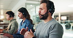 Business, call center and man in office, discussion or communication with help desk. People, consultation or employees in workplace, headset or customer service with tech support, talking or feedback