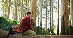 Hiking, coffee and man in nature with flask for rest, thinking and break in forest, woods and outdoor. Relax, mountain and person with drink, beverage and tea for fresh air, exercise and adventure 