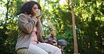 Drinking coffee, camping and woman with nature, morning and summer holiday with weekend break. Couple, outdoor and campers with tea, start day and caffeine with adventure, calm and sustainability