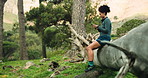 Relax, athlete and woman with smartphone in forest, rest or check progress on fitness app in nature. Outdoor, break and African person with mobile for workout goals, browsing and online in woods