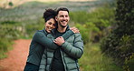 Happy couple, hug and nature with love for hiking adventure, outdoor journey or getaway in forest. Man, woman or embrace with smile for trekking commitment, health or wellness on path in wilderness
